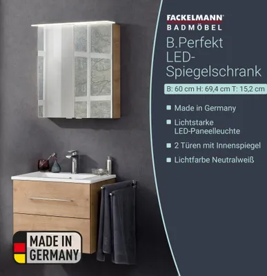 A bathroom vanity with a mirror cabinet and towels.