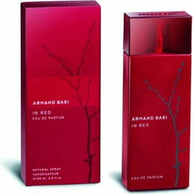 A red perfume box and bottle are displayed side-by-side against a white background.