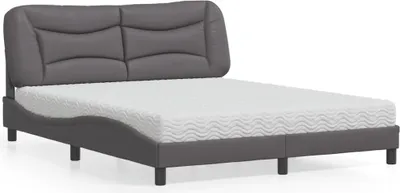 A bed with a mattress on a white background.