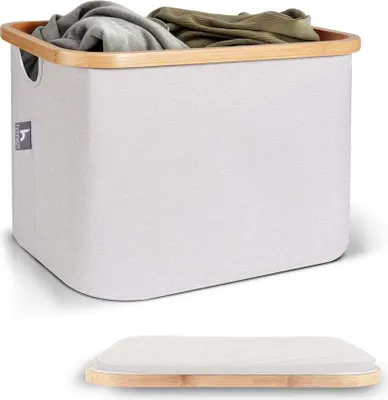 A laundry basket filled with clothes, with a separate lid shown below.