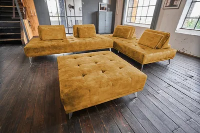 Produktbild von KAWOLA Sofa WIOLO Ecksofa velvet mit Hocker cognac