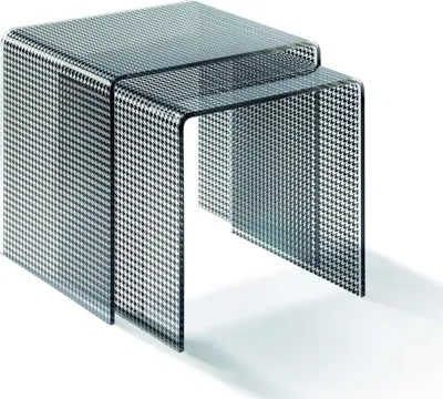 Two nesting side tables with a houndstooth pattern.