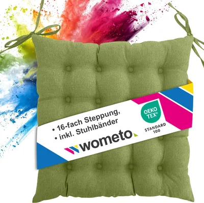 A green seat cushion with a colorful powder explosion in the background.