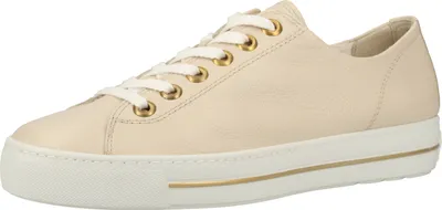 A single cream-colored sneaker with white laces and gold eyelets is shown from a side angle against a white background.