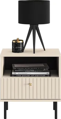 A bedside table with a lamp and a decorative jar on top.
