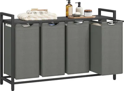 A laundry sorter with four compartments and a shelf on top, holding towels and toiletries.