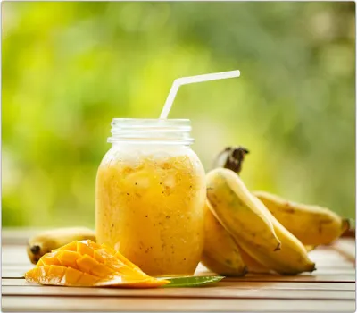 Produktbild von Spritzschutz Herdabdeckplatte Schneidebrett aus Glas Smoothie aus Mango  1-Teilig (60x52cm)