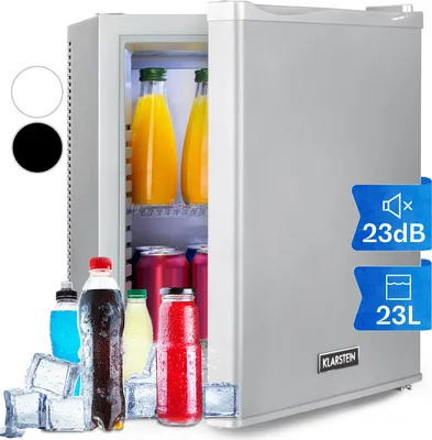 A silver mini-fridge with its door open, showing bottles of juice and cans inside. Several bottles and ice cubes are placed in front of the fridge.