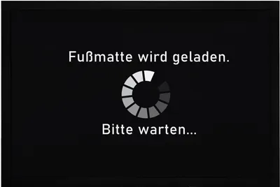 Produktbild von Fußmatte mit Spruch lustig Fußmatte wird geladen Bitte warten loading rutschfest & waschbar Moonworks® schwarz 60x40cm