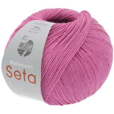 A ball of pink yarn with a label.
