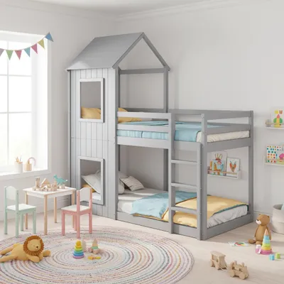 A children's bedroom with a bunk bed, a small table and chairs, and toys.