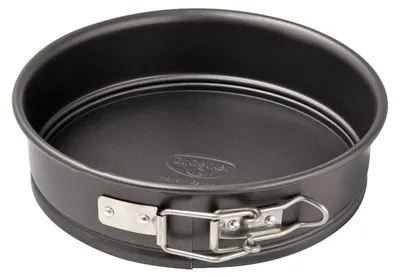 A black springform cake pan with a silver latch is shown against a light gray background.