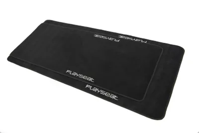 Two black floor mats are stacked on a white background.