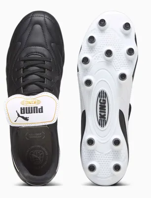 A top-down view of a pair of black Puma King soccer cleats, showing both the top of the shoe and the sole.