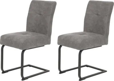 Two grey dining chairs with black metal frames are shown against a white background.