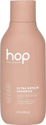 A pink bottle of Montibello Hop Ultra Repair Shampoo.