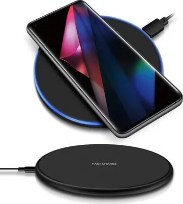 A smartphone is wirelessly charging on a black charging pad, with a second charging pad shown below.