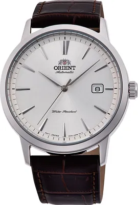 A close-up studio shot of an Orient watch with a white dial and a brown leather strap.