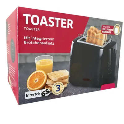The image shows the packaging of a black toaster, along with some illustrative elements like orange slices, toast, and orange juice.