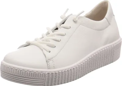 A white leather sneaker with a thick, textured sole is shown from a side-angle against a white background.