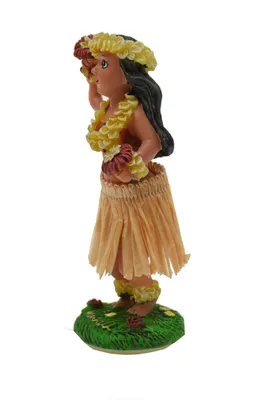 A figurine of a hula dancer on a green base.