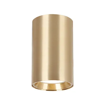 A cylindrical gold lamp shade is shown against a white background.