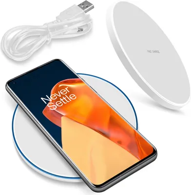 A smartphone and a wireless charging pad are displayed together, along with a USB cable.