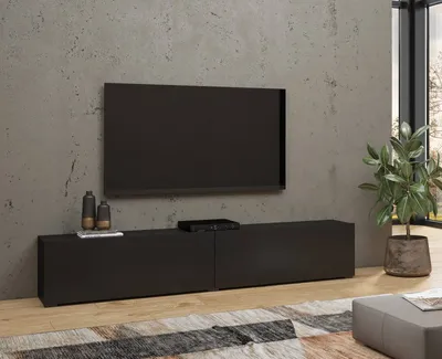 A modern living room with a TV and media console.
