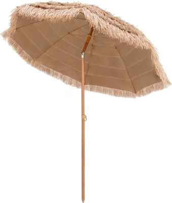 A tan beach umbrella with fringe detailing and a wooden pole, isolated on a white background.