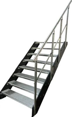 A metal staircase with a railing against a white background.