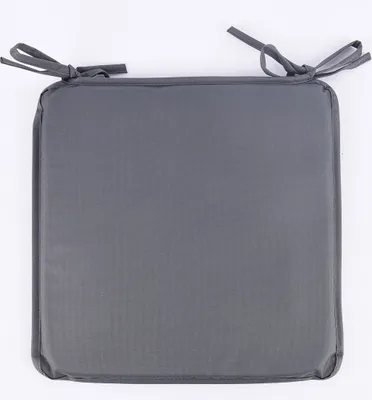 A square dark gray seat cushion with ties on a white background.