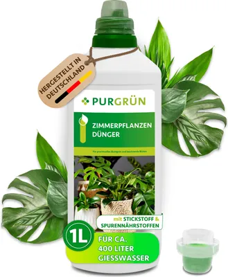 A bottle of Purgrün Zimmerpflanzen-Dünger surrounded by green leaves.