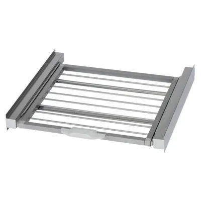 A close-up, studio shot of a retractable drying rack for a washing machine or dryer.