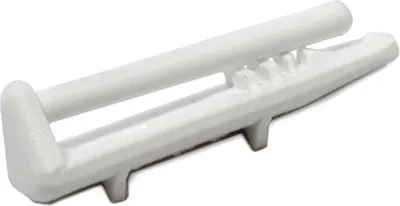 A white plastic part for a dishwasher.