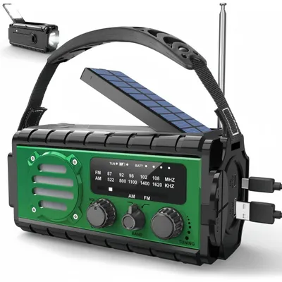 A green and black emergency radio with a solar panel and a flashlight.