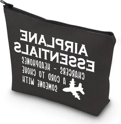 Image de Valise de voyage avec accessoires de voyage et prise de recharge.