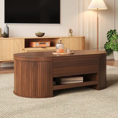 A living room scene with a coffee table in the foreground and a TV and entertainment center in the background.