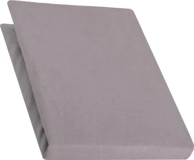 A folded grey bed topper on a white background.