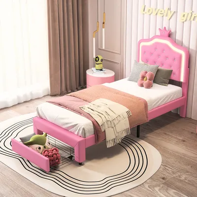 A child's pink bed with LED lights and storage drawers, set in a bedroom.