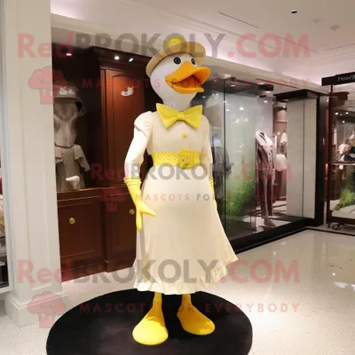 Obrázek produktu pro Kostýmová REDBROKOLY postava maskota žluté pižmové kachny v šatech a čepicích