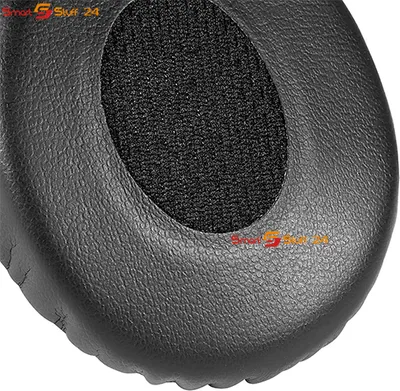 A close-up view of a black headphone earpad.