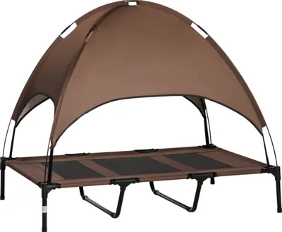 A brown elevated dog bed with a canopy.