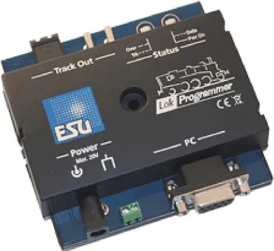 A close-up, angled view of an electronic device, likely a programmer or interface module, with visible labels and connectors.