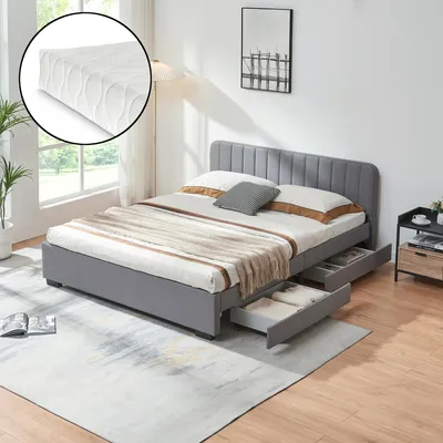 A bedroom scene featuring a bed with storage drawers, a nightstand, and a rug.