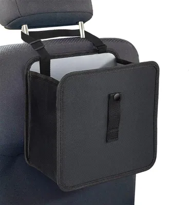 A black car trash can is hanging on the back of a car seat.