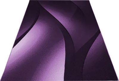 A purple rug with an ombre design.