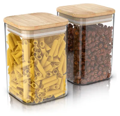 Two clear glass storage jars with bamboo lids, one filled with penne pasta and the other with coffee beans, are displayed against a white background.