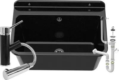 A black sink with a faucet and plumbing parts.