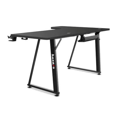 A black L-shaped gaming desk is shown against a white background.