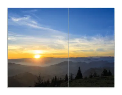 Produktbild von Wallario Herdabdeckplatte aus Glas, Größe 70 x 52 cm 2-teilig, Motiv Sonnenaufgang über dem Schwarzwald